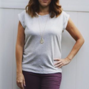 Francesca’s gray top with lace up back